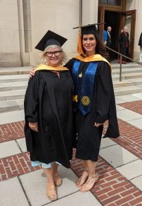 photo of Sandy Lemkin at her MSN graduation with fellow classmate Courtney Keatting